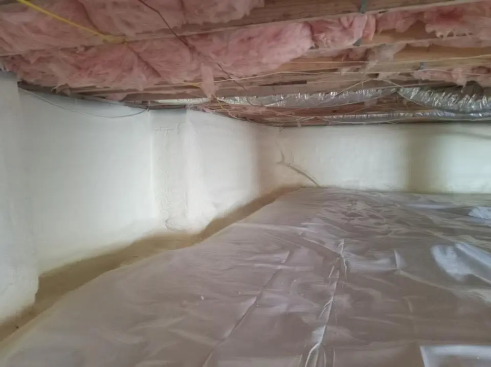 Crawl space encapsulation with closed-cell spray foam for Commercial Roof Restoration in Grinnell